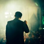 comedian performing on stage