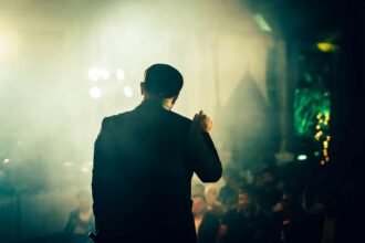 comedian performing on stage