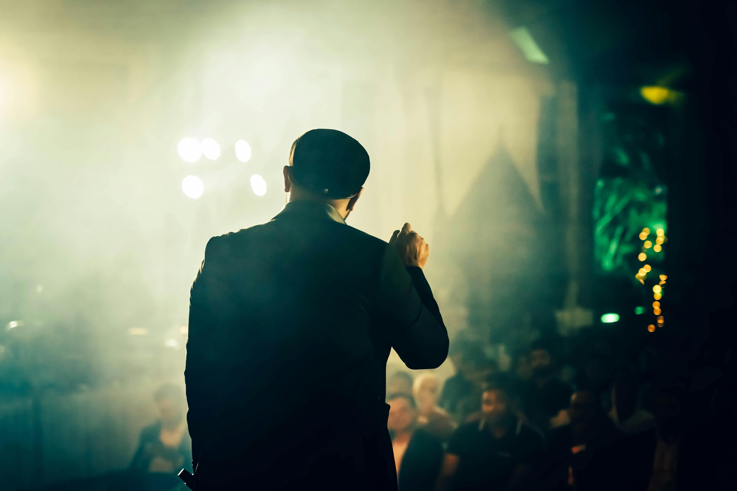 comedian performing on stage